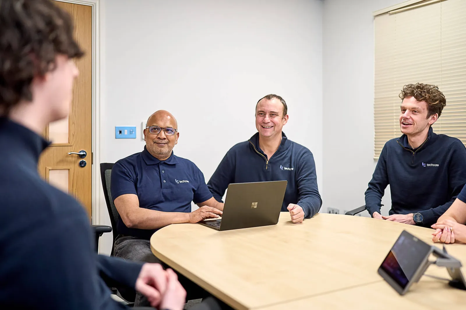 Techcare Team in a smart meeting room